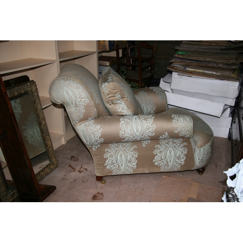 796 - A Howard style silk upholstered armchair.