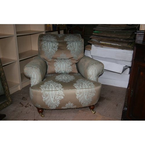 796 - A Howard style silk upholstered armchair.