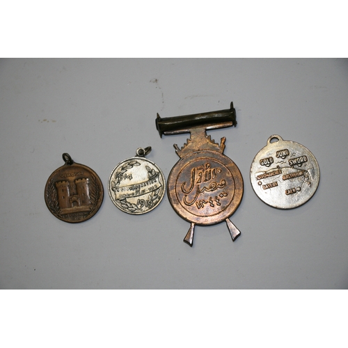 1068 - A 1916 Verdun medal, a 1919 Great War medal, a WW2 D-Day medal together with a Middle East medal