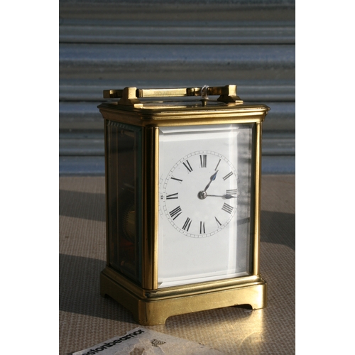 131 - A brass cased repeater carriage clock, the white enamel dial with Roman numerals, the movement strik... 