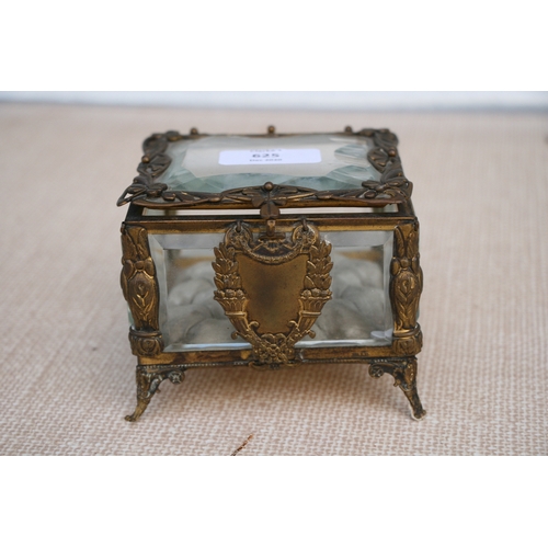 625 - A Victorian gilt metal and glass jewellery casket, 11 by 11 by 9cm (4.25 by 4.25 by 3.5 ins).