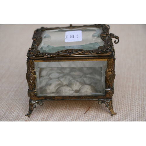 625 - A Victorian gilt metal and glass jewellery casket, 11 by 11 by 9cm (4.25 by 4.25 by 3.5 ins).