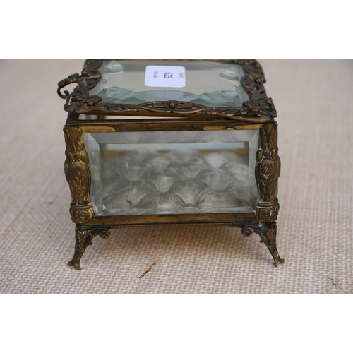 625 - A Victorian gilt metal and glass jewellery casket, 11 by 11 by 9cm (4.25 by 4.25 by 3.5 ins).