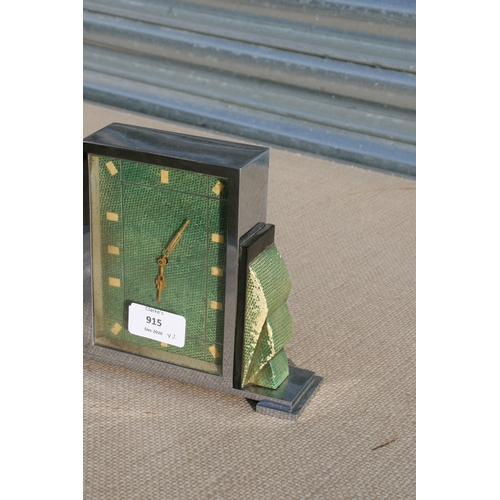 915 - A 1930s Art Deco chrome and faux shagreen mantel clock, 15cm (6 ins) high; together with a French br... 