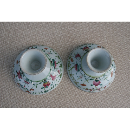 498 - A pair of Chinese famille rose tazzas, 17cms (6.75ins) diameter; together with a Chinese dish decora... 