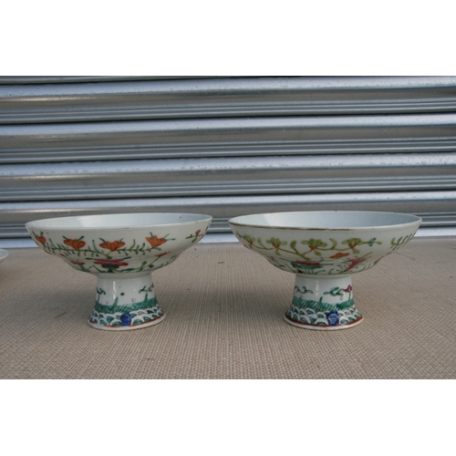 498 - A pair of Chinese famille rose tazzas, 17cms (6.75ins) diameter; together with a Chinese dish decora... 