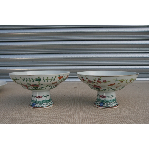 498 - A pair of Chinese famille rose tazzas, 17cms (6.75ins) diameter; together with a Chinese dish decora... 