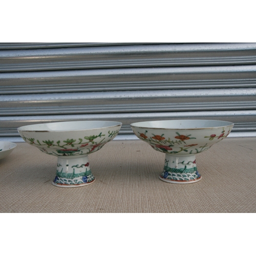 498 - A pair of Chinese famille rose tazzas, 17cms (6.75ins) diameter; together with a Chinese dish decora... 