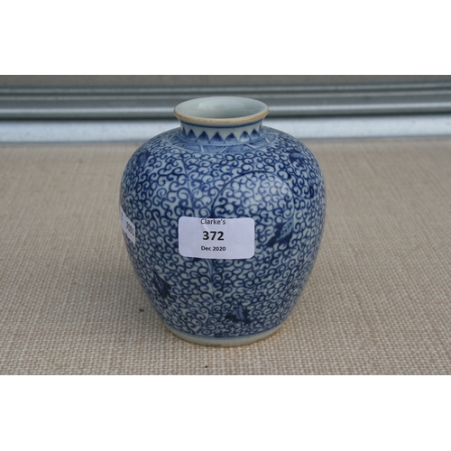 372 - A Chinese blue & white vase decorated with flowers and foliate scrolls, 13cms (5ins) high; together ... 