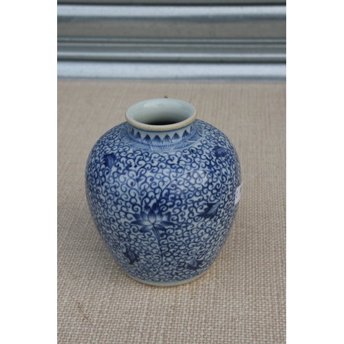 372 - A Chinese blue & white vase decorated with flowers and foliate scrolls, 13cms (5ins) high; together ... 