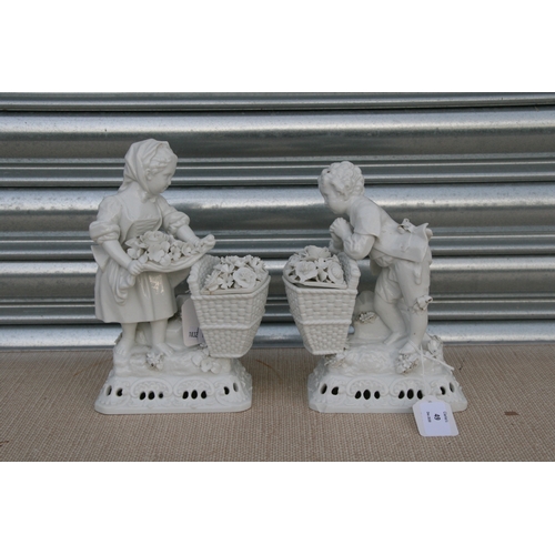 49 - A pair of Meissen style blanc de chine figural groups in the form of a young boy and girl with baske... 