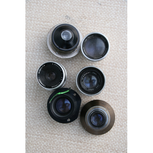 897 - A quantity of camera lenses to include Fijinon-TV-Z 1;18/18-100 lens and other similar lenses.