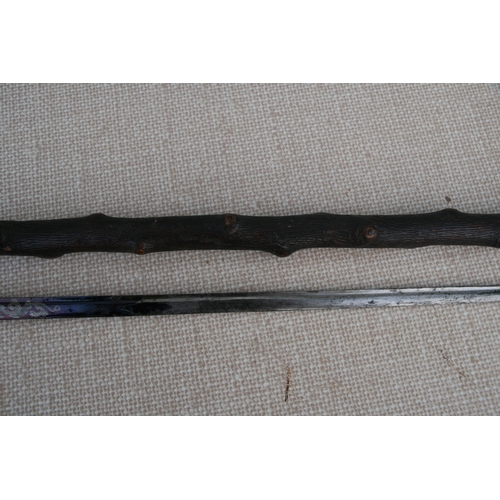 279 - A knotted wood (possibly Blackthorn) sword stick with tapering tapering steel blade. 85cm ( 33.5 ins... 