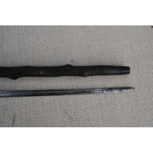 279 - A knotted wood (possibly Blackthorn) sword stick with tapering tapering steel blade. 85cm ( 33.5 ins... 