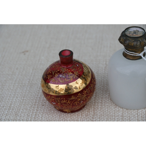 607 - A 19th century French opaline glass perfume bottle, the hinged lid inset with an image of a palace, ... 