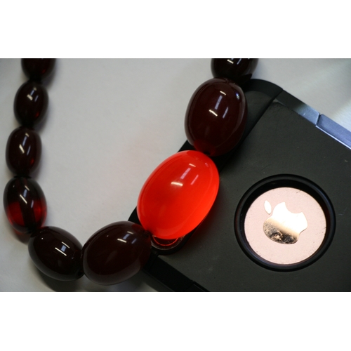 229 - A quantity of cherry amber bead necklaces to include four long necklaces, four faceted cherry amber ... 