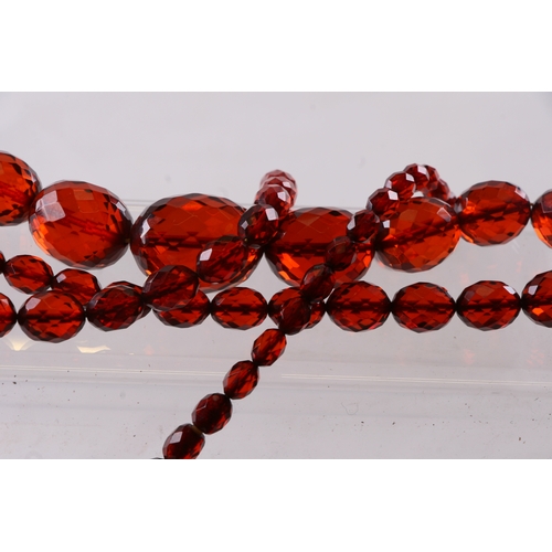 229 - A quantity of cherry amber bead necklaces to include four long necklaces, four faceted cherry amber ... 