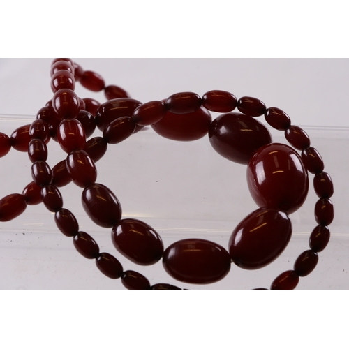 229 - A quantity of cherry amber bead necklaces to include four long necklaces, four faceted cherry amber ... 