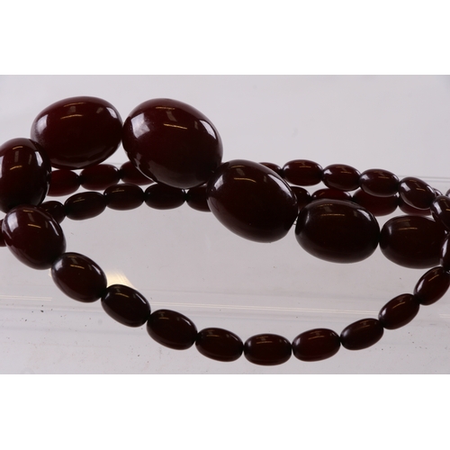 229 - A quantity of cherry amber bead necklaces to include four long necklaces, four faceted cherry amber ... 