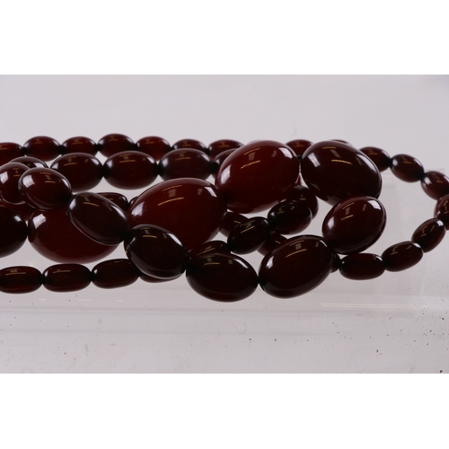 229 - A quantity of cherry amber bead necklaces to include four long necklaces, four faceted cherry amber ... 