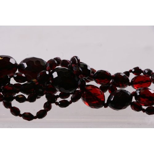 229 - A quantity of cherry amber bead necklaces to include four long necklaces, four faceted cherry amber ... 