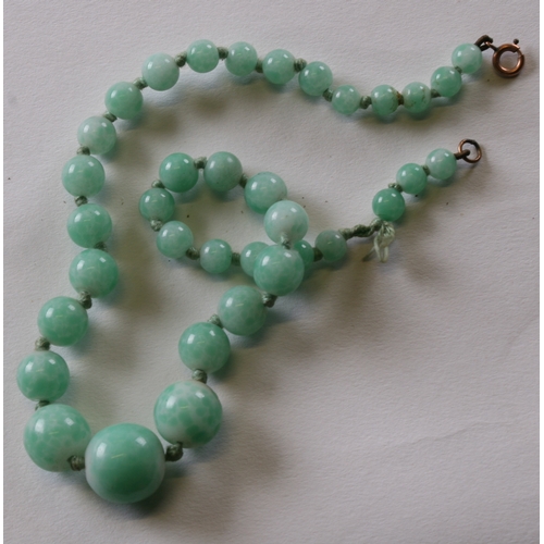 234 - A group of jade / hardstone necklaces; together with similar elephant figures.