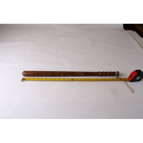 283 - A late Victorian / Edwardian ebony truncheon, 54cms (21ins) long; together with two similar truncheo... 