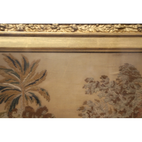 737 - An early 19th century silkwork picture depicting Moses in the bulrushes, framed & glazed, 67 by ... 