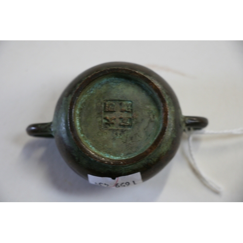 416 - A late 19th century Chinese miniature bronze censer with four character mark to base, 7.7cms (3ins) ... 