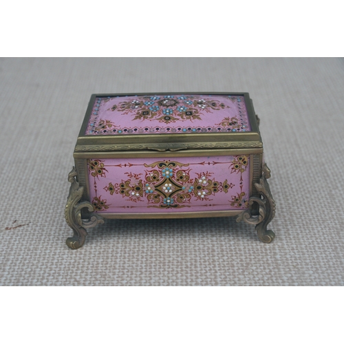 603 - A 19th century French enamel trinket box in the manner of Tahan of Paris, the pink ground with appli... 