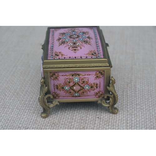 603 - A 19th century French enamel trinket box in the manner of Tahan of Paris, the pink ground with appli... 