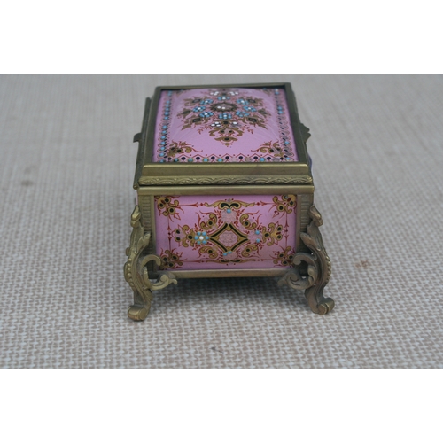 603 - A 19th century French enamel trinket box in the manner of Tahan of Paris, the pink ground with appli... 