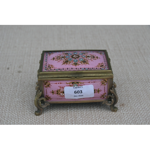 603 - A 19th century French enamel trinket box in the manner of Tahan of Paris, the pink ground with appli... 