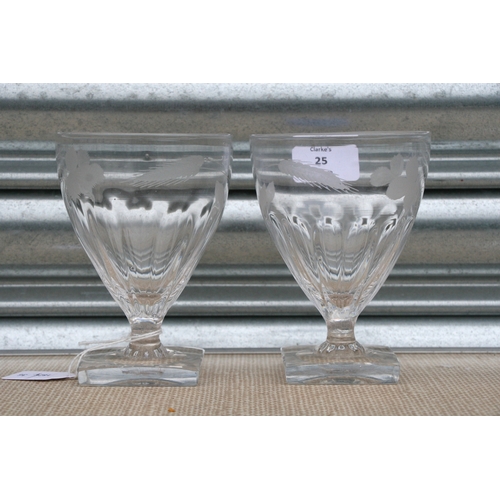 25 - A pair of Georgian ale glasses with engraved wheat and hop decoration, on square bases, 13cm (5 ins)... 