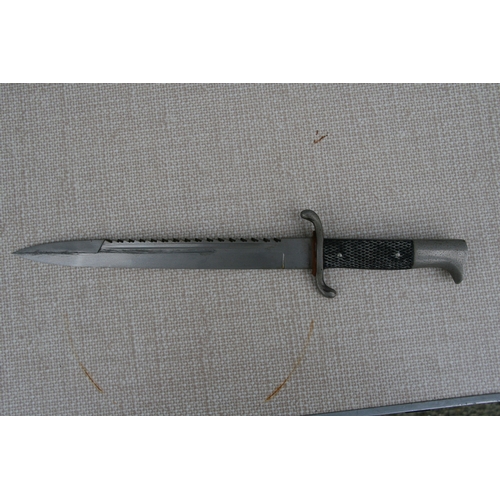 308 - A WW2 Third Reich Nazi firemans dress / parade Sawback Dagger in its steel scabbard. Makers initials... 