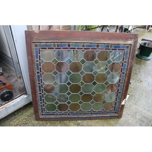 10 - Two stained glass panels in an oak frame, 174 by 86cms (68.5 by 34.5ins) two similar framed separate... 