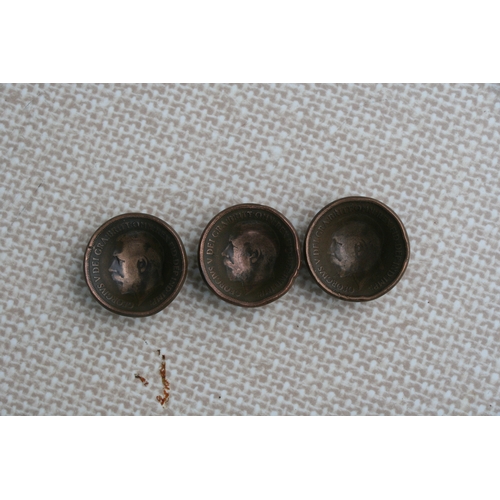 1066 - A set of five WW1 trench art Tommy helmets made from British pennies, one for each year of the Great... 