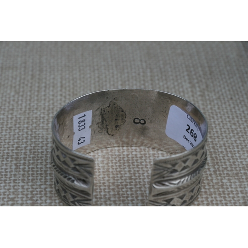 268 - A Navajo Indian silver cuff bracelet with geometric stamped decoration, maker's mark No.8 for Henry ... 