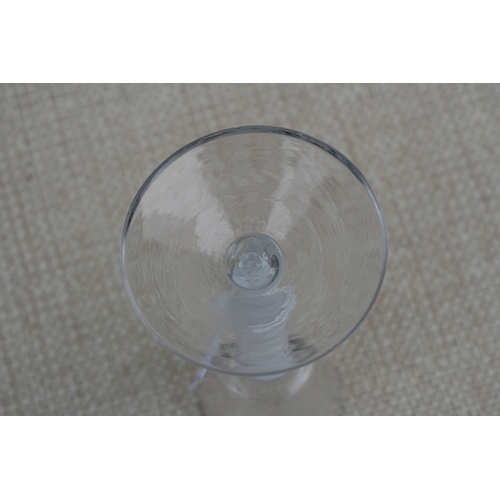 26 - An 18th / 19th century air twist wine glass with double helix to the stem, 16cms (6.25ins) high; tog... 