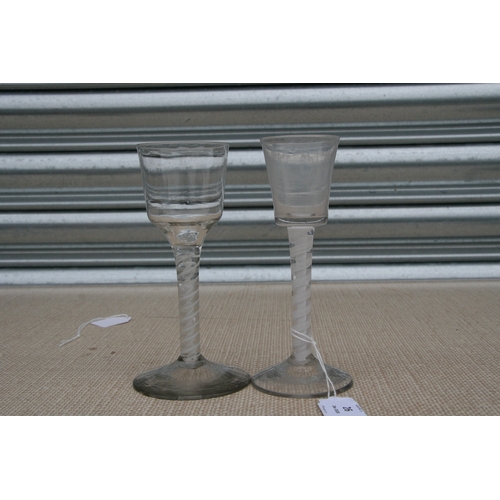 26 - An 18th / 19th century air twist wine glass with double helix to the stem, 16cms (6.25ins) high; tog... 