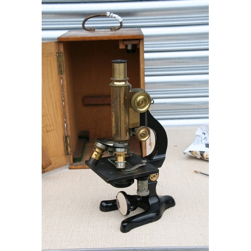 102 - A lacquered brass monocular microscope,  'Otto Himmler, Berlin No. 20145C966', in an oak case. 30cm ... 