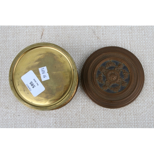 595 - A French gilt metal dressing table box, 11cms (4.75ins) diameter.