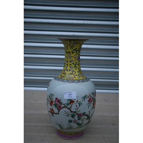 557 - A Chinese Republic famille rose vase decorated with pomegranates, red seal mark to the underside, 33... 