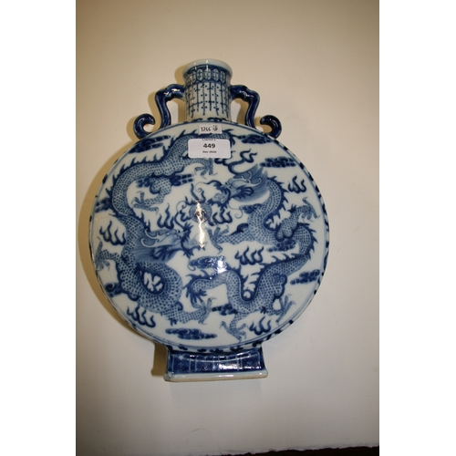 449 - A Chinese blue & white moon flask decorated dragons chasing a flaming pearl and foliate scrolls, fou... 