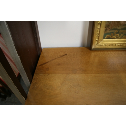 779 - A Monk Man Arts & Crafts style oak sideboard with four drawers above two pairs of panelled doors, on... 