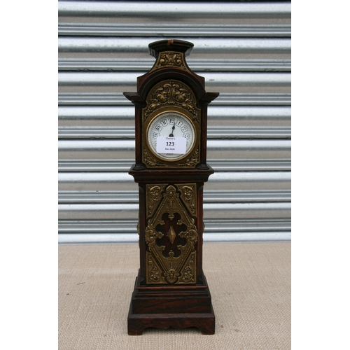 123 - A 19th century style oak miniature longcase clock, the hood and trunk with applied brass decoration,... 