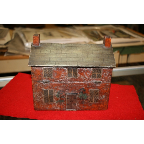 577 - A folk art style perfume caddy in the form of a cottage, interior fitted with a pair of flashed cut ... 