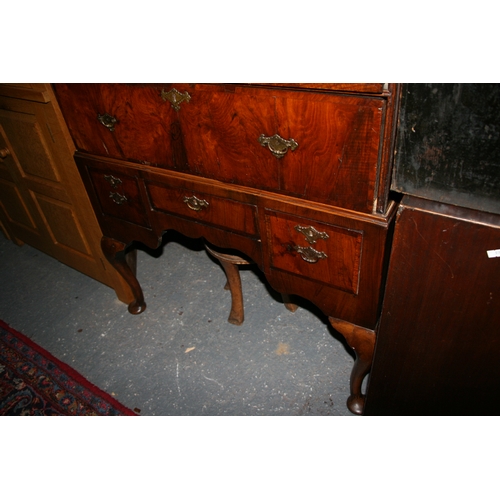 770 - An 18th century walnut chest on stand with an arrangement of five drawers above a stand with three d... 