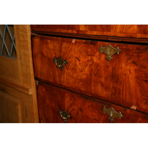 770 - An 18th century walnut chest on stand with an arrangement of five drawers above a stand with three d... 