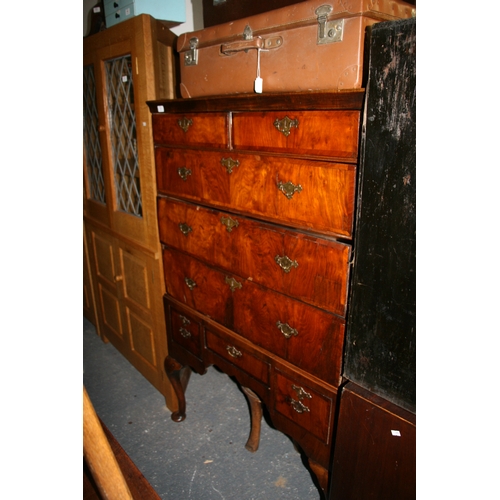 770 - An 18th century walnut chest on stand with an arrangement of five drawers above a stand with three d... 